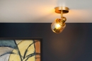 Foto 15150-1 sfeerfoto: Gouden spot met kapje van glas in amberkleur