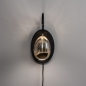 Foto 15235-2: Zwarte led wandlamp met eivormig glas in amberkleur