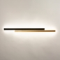 Foto 15467-2 vooraanzicht: Grote led wandlamp in zwart met messing/goud in uniek design