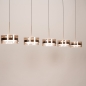 Foto 16240-3: Een moderne 5-lichts hanglamp met warme accenten