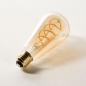 Foto 402-7: Vintage LED Lichtquelle in Bernsteinfarbe, die einer Kohlefadenlampe ähnelt.