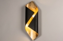 Foto 74146-1: Große, geschwungene Wandleuchte in Schwarz und Gold, geeignet für LED-Beleuchtung.