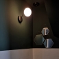 Foto 74260-8: Zwarte hotel chique wandlamp met bol van wit glas