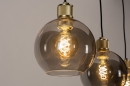 Foto 74396-11: Moderne, stimmungsvolle Pendelleuchte mit drei Kugeln aus Rauchglas und außerordentlich schön verarbeiteten messingfarbenen Fassungen. 