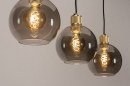 Foto 74396-5: Moderne, stimmungsvolle Pendelleuchte mit drei Kugeln aus Rauchglas und außerordentlich schön verarbeiteten messingfarbenen Fassungen. 