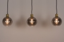 Foto 74396-7: Moderne, stimmungsvolle Pendelleuchte mit drei Kugeln aus Rauchglas und außerordentlich schön verarbeiteten messingfarbenen Fassungen. 