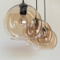 Foto 75779-13: Trendy hanglamp voorzien van drie glazen bollen in een champagnekleur